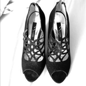 Black sparkling heels.